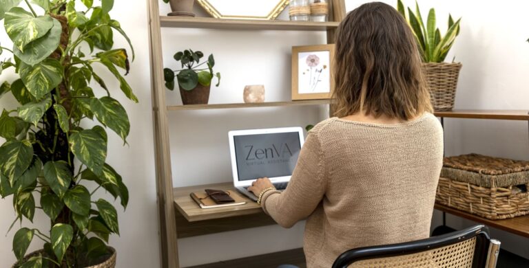 Catrin sitting at a desk with stationery and shelves